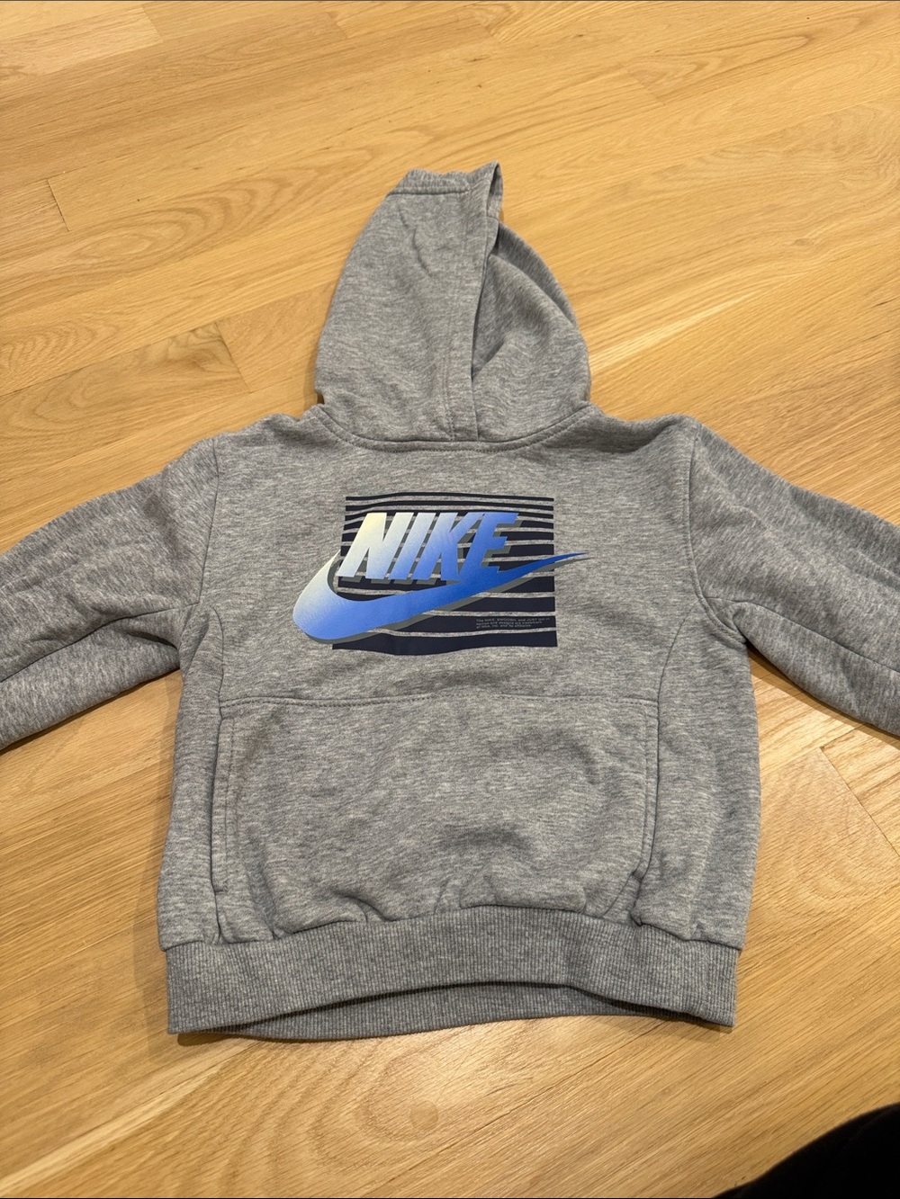 Nike Grey Kids Hoodie with Blue Swoosh Graphic